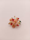 Floral designer brooch with gold-tone finish