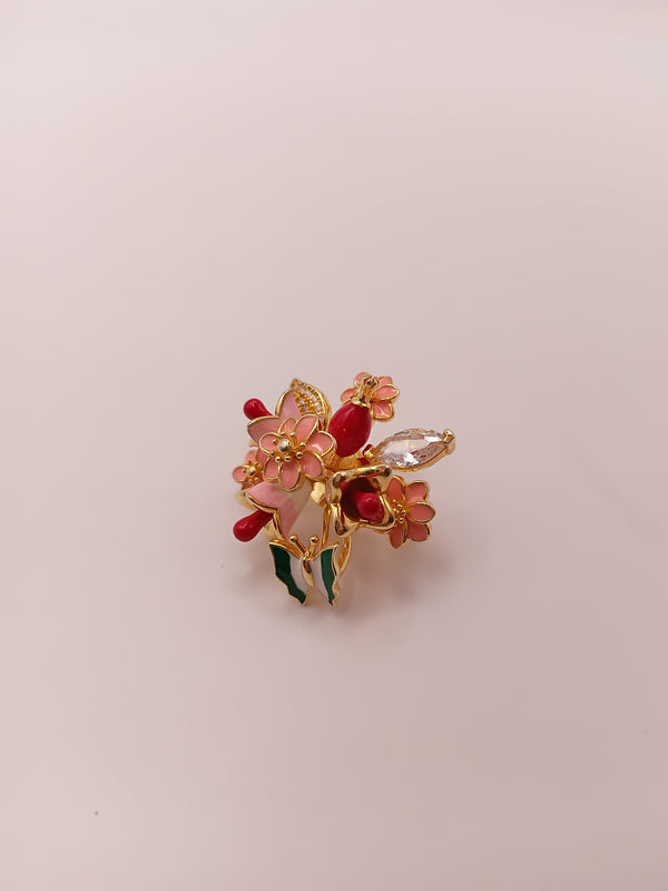Floral designer brooch with gold-tone finish