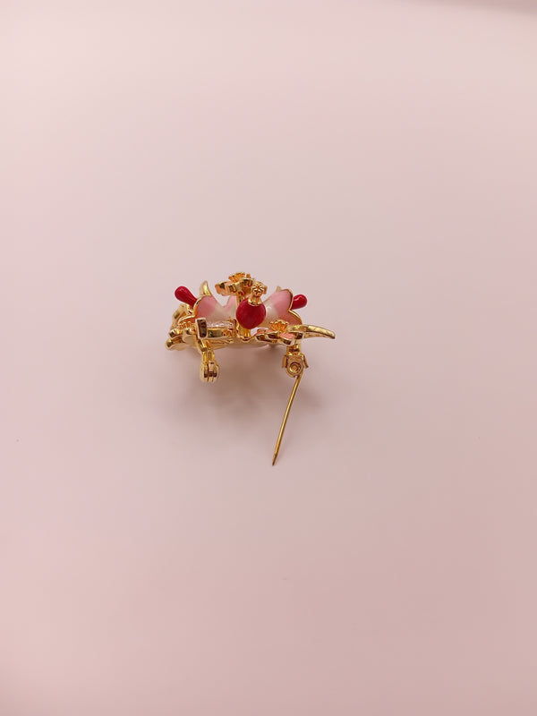 Floral designer brooch with gold-tone finish